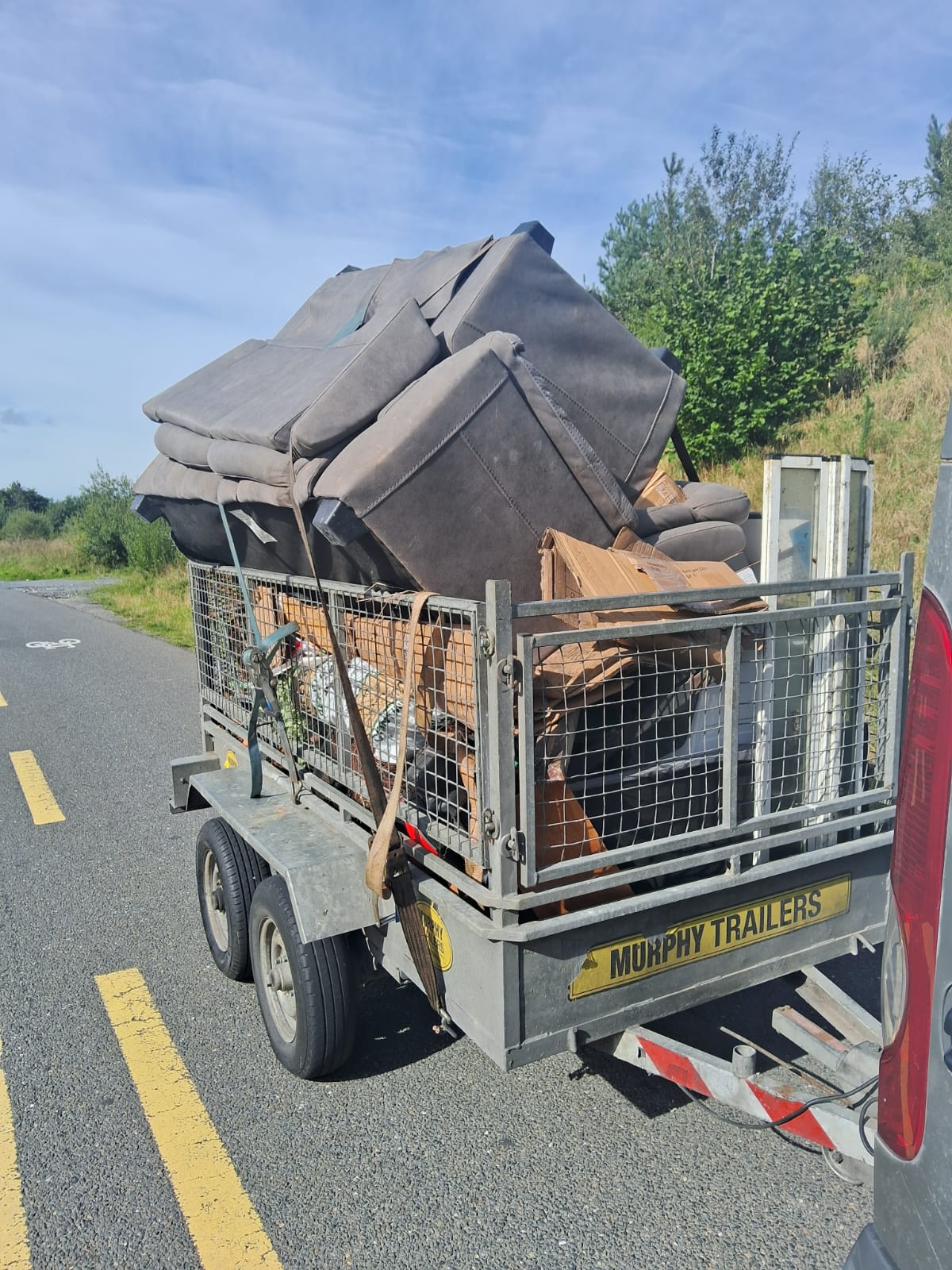 Spencer Waste Removal trailer loaded for collection